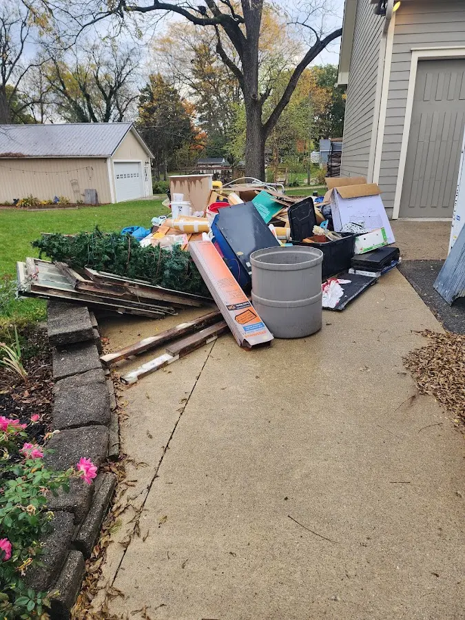 Dumpster being loaded with debris for Roofing Dumpster Rental in Old Fig Garden